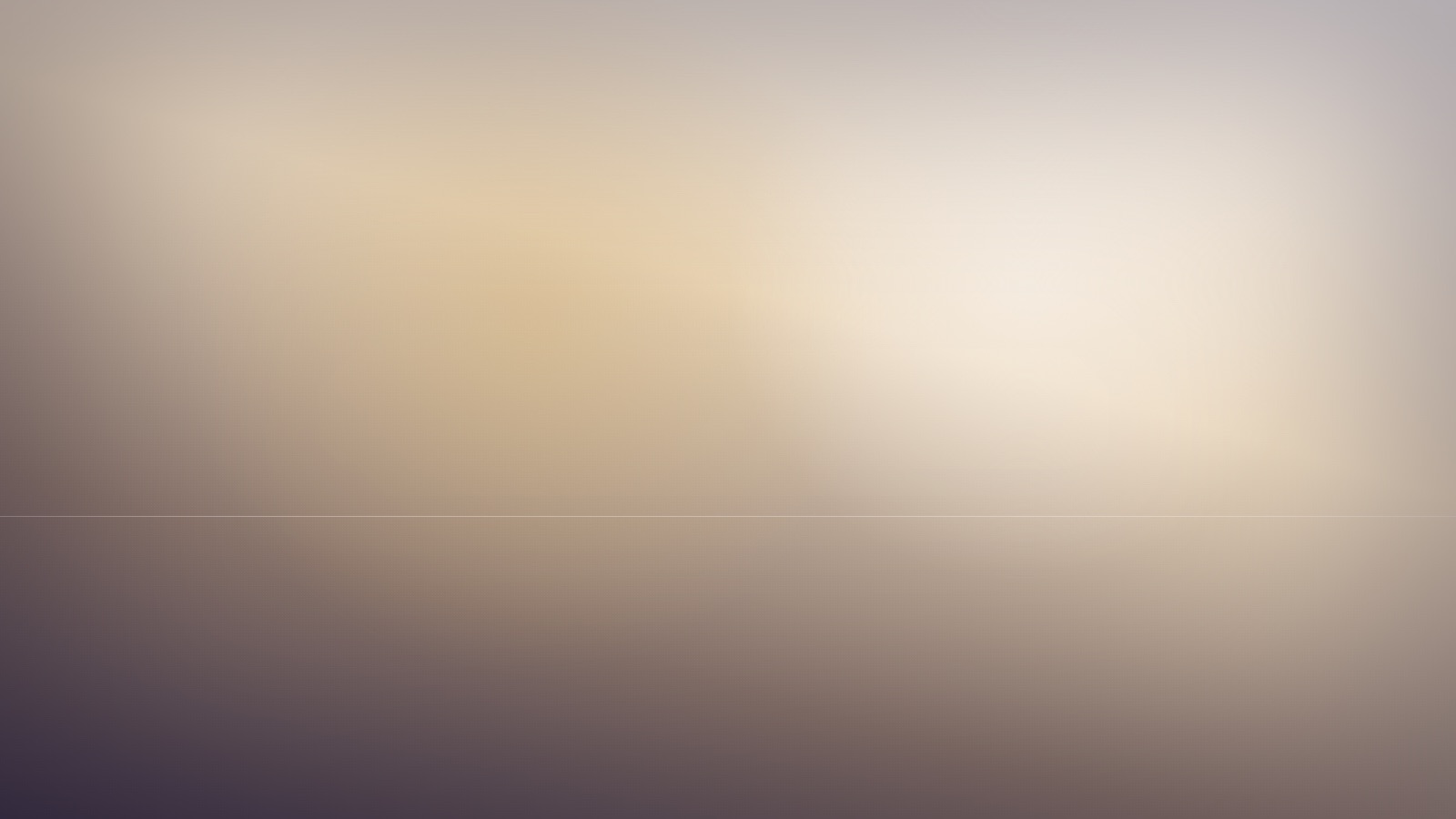 A broad expanse of soft, even colour beneath a still and quiet sky.